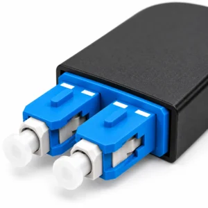 Close-up detail of dual blue SC UPC connectors on a duplex singlemode fiber optic loopback module
