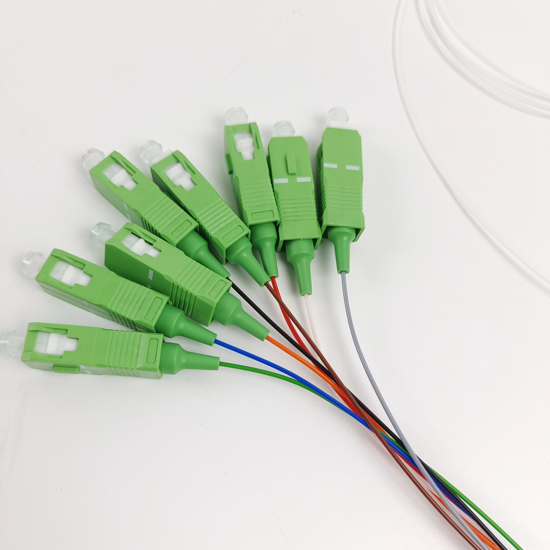 Close-up of the green SC/APC output connectors on the PLC Splitter 1x8 fiber assembly